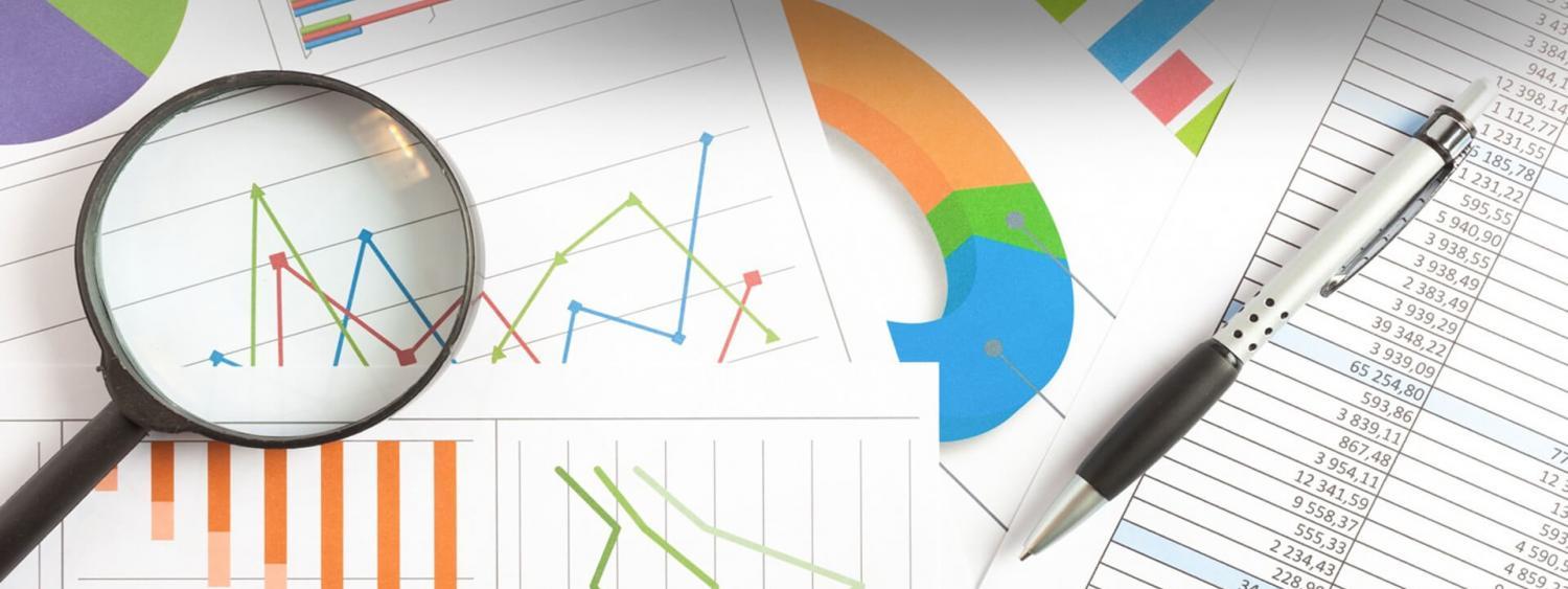 Picture of magnifying glass and figures and graphs