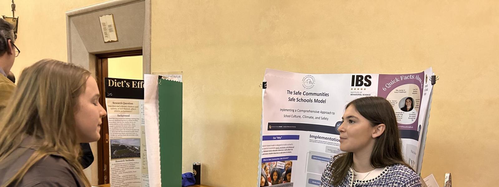 Student explains her poster.
