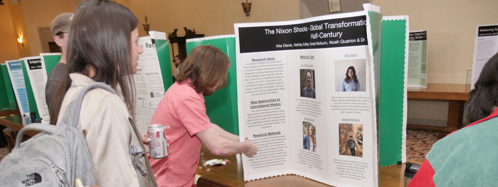 student presenting poster about studio lab work