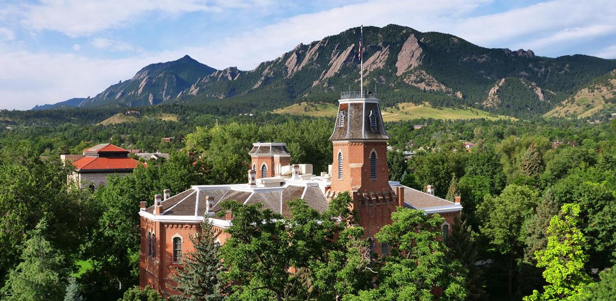 Old Main with the Flatirons in the background