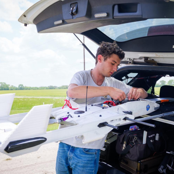 Céu Gómez-Faulk makes adjustments to the RAAVEN drone
