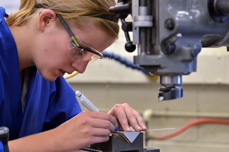 Researcher working in the JILA Machine Shop