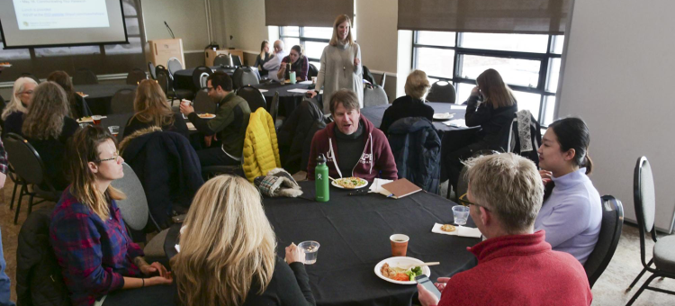 Faculty workshop groups at tables