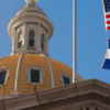 Colorado state capitol with American flag and Colorado flags flying