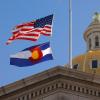 Colorado state capitol with U.S. and Colorado state flags