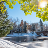 CU Boulder campus shot of sunny lake in winter