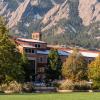 CU Boulder campus building with Flatirons in background