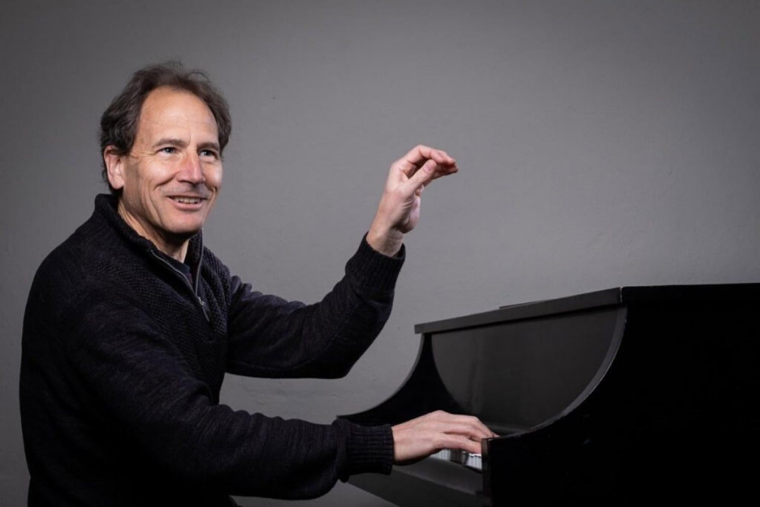 Professor David Korevaar at the piano