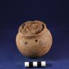 Complete medium brown ware collared jar with suspension holes. Recovered as offering with child burial B9-I11. Still contains sediment. / Vasija completa tipo café mediano con cuello y hoyos de suspensión. Hallado como ofrenda con el entierro infantil B9-11. Todavía contiene sedimento.