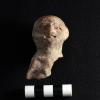 Partial anthropomorphic figurine from LC12 E-F10 burn feature in midden. / Parte de una figurilla antropomorfa de LC12 E-F10 elemento de quema dentro de un basurero.