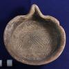 Complete grater bowl with spout recovered as offering with child burial B11-I13. / Molcajete con boca hallado como ofrenda en el entierro infantil B11-I13.