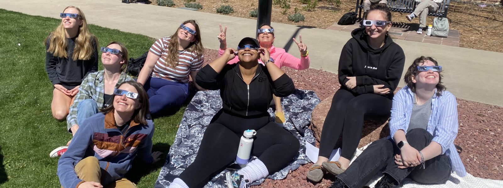 students looking at the eclipse
