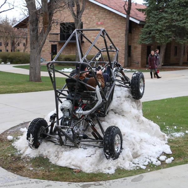 Crawling up snow berm