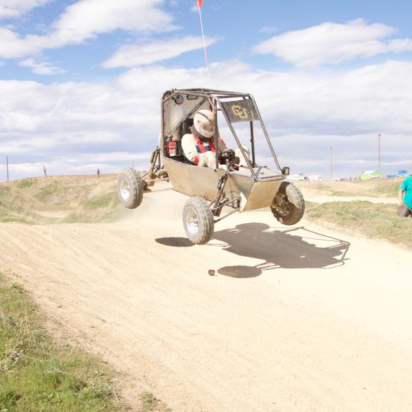 Bill taking the car off of a jump