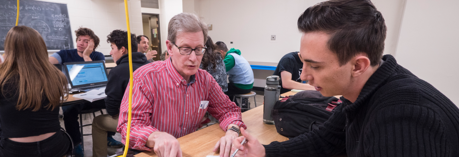 Faculty and student in a physics lab