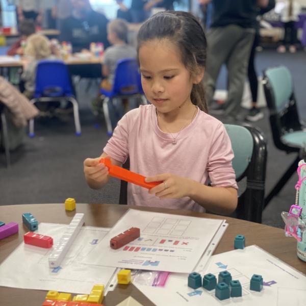 child doing tabletop math activity