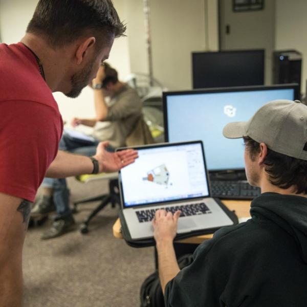 mentor pointing to student's screen