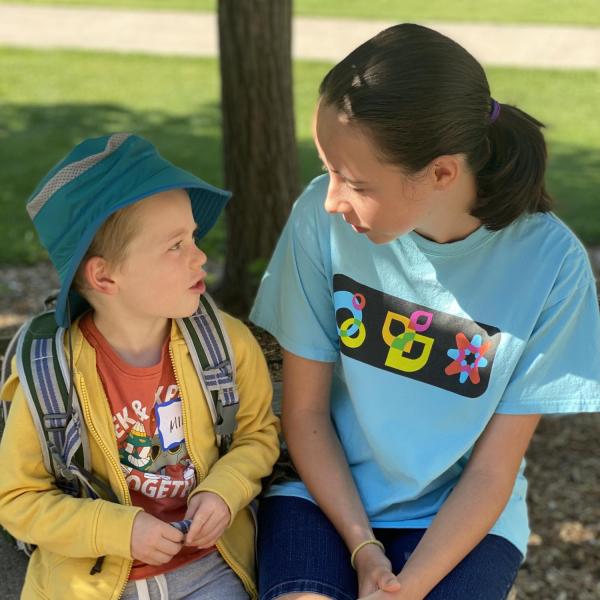 volunteer talking with camper