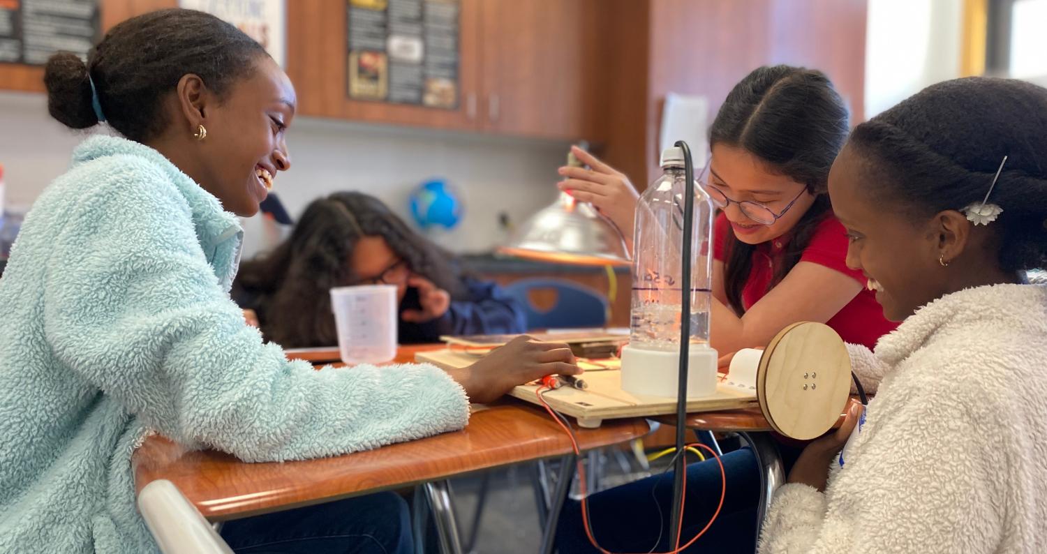 3 students doing tabletop activity