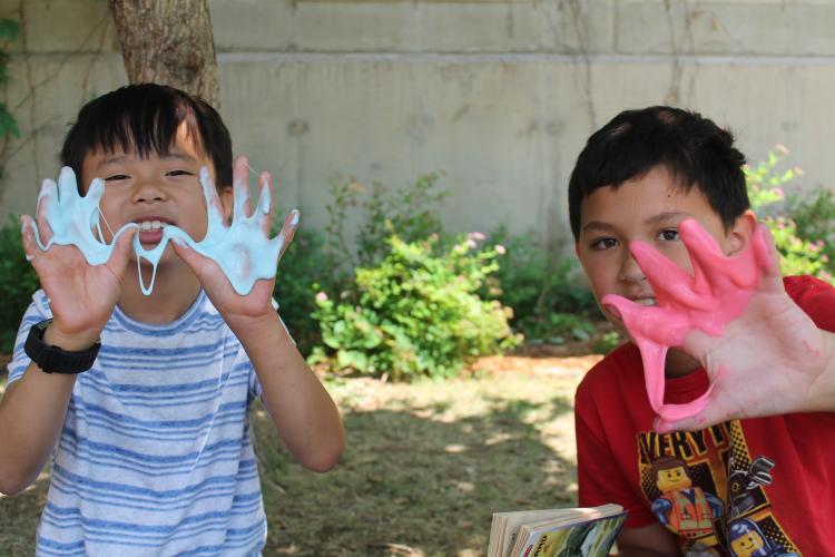 2 boys with slime hands