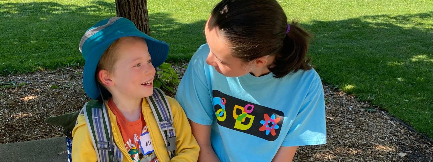 volunteer talking with student