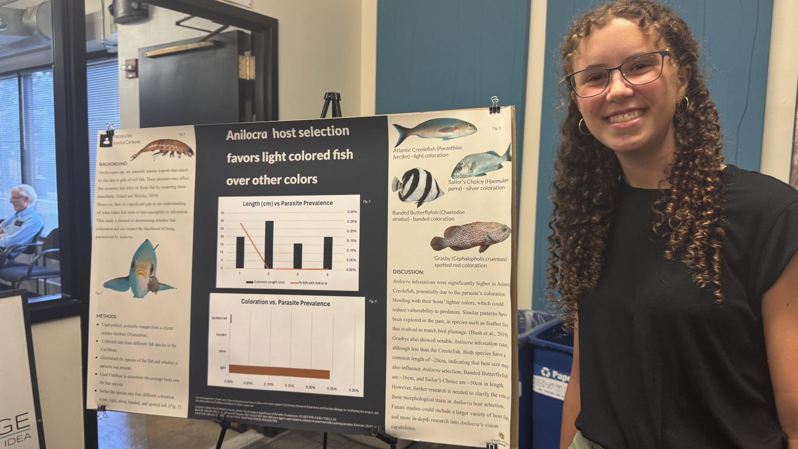 stem research experience student with poster