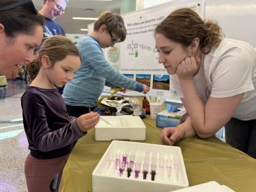 STEAMfest attendee visiting activity table