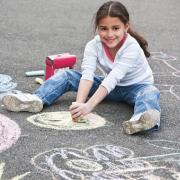girl doing chalk art