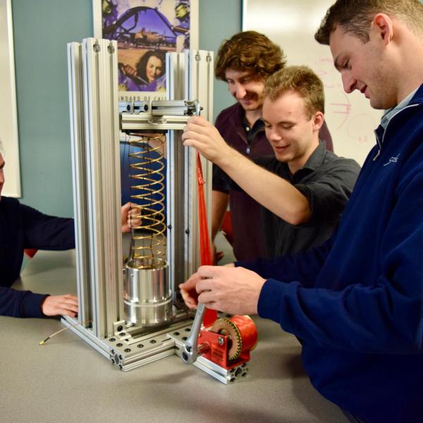 Students from Paul M. Rady Department of Mechanical Engineering with compatible antenna