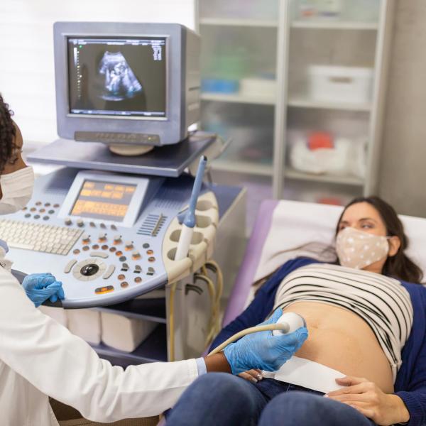 Doctor performing a sonogram on a patient