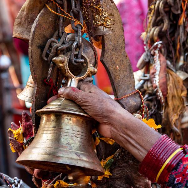 Hand holding a bell