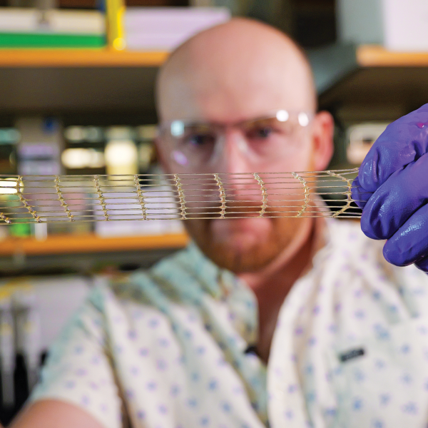 Matt Davidson, a research associate in the Burdick Lab, shows off a 3D-printed material that could be used for a variety of medical applications