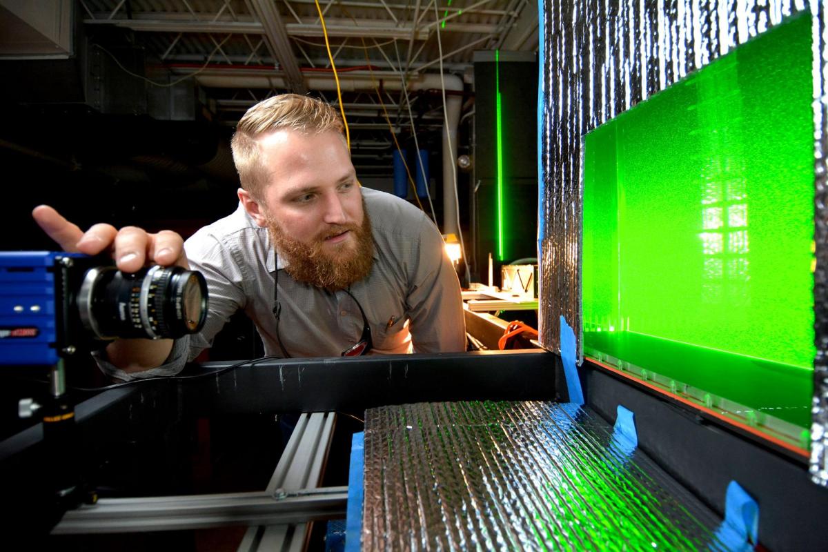 Student with camera and screen in Civil Engineering lab