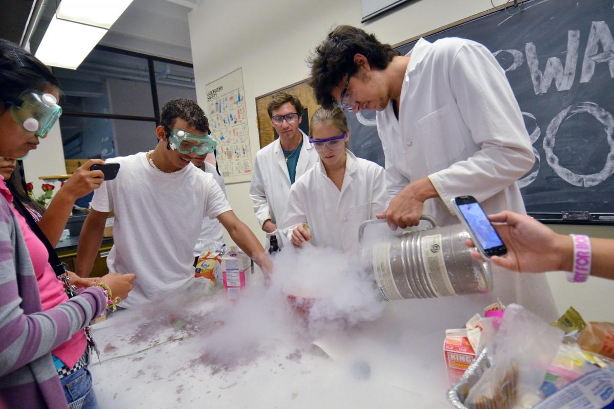 Students and faculty doing research in lab