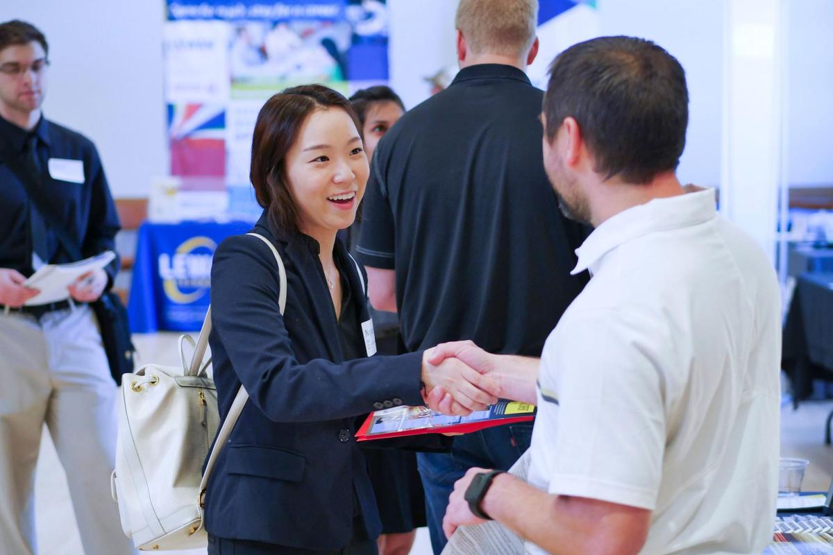 Two people shaking hands at Career Fair