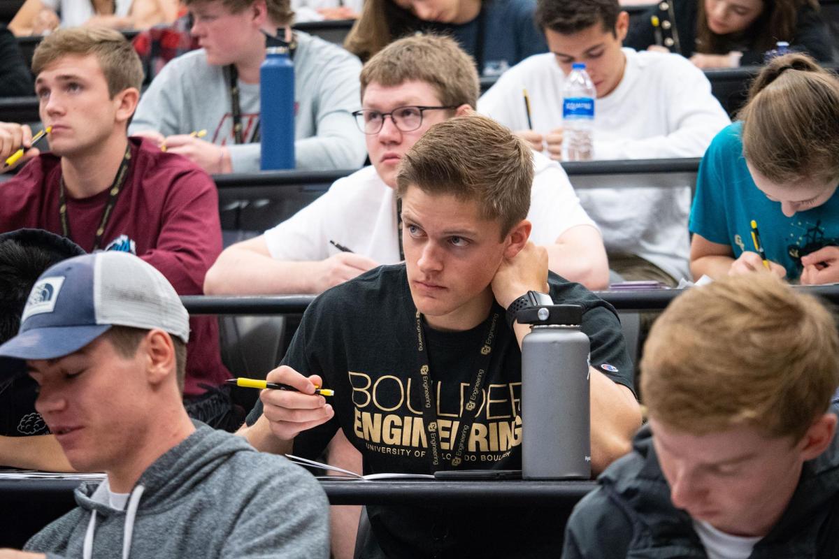 Students attending class in lecture hall