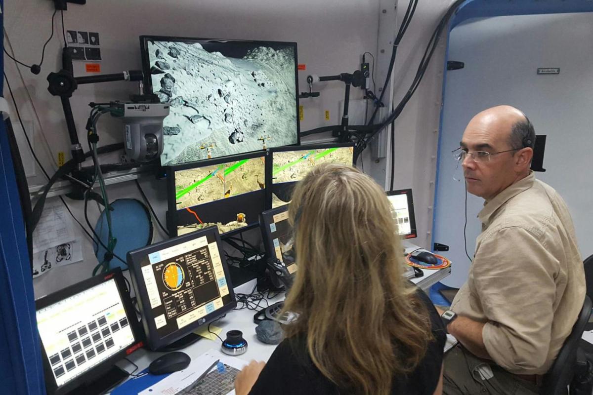 Professor in lab with astronomy student