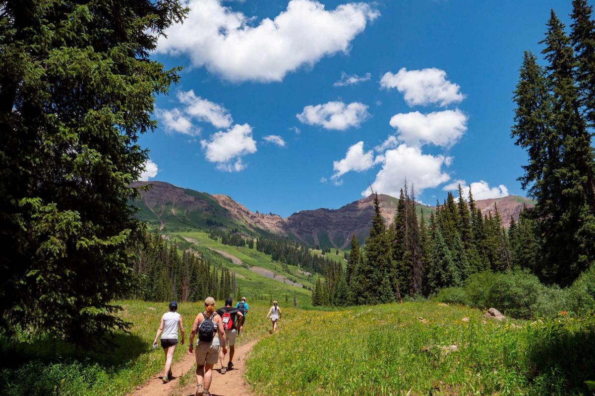 Students hiking on mountain path
