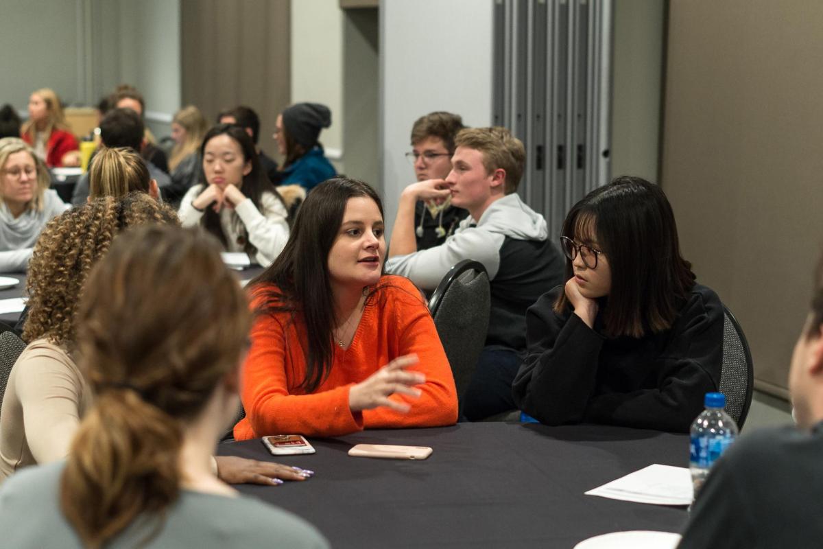 Students sitting at conference room tables