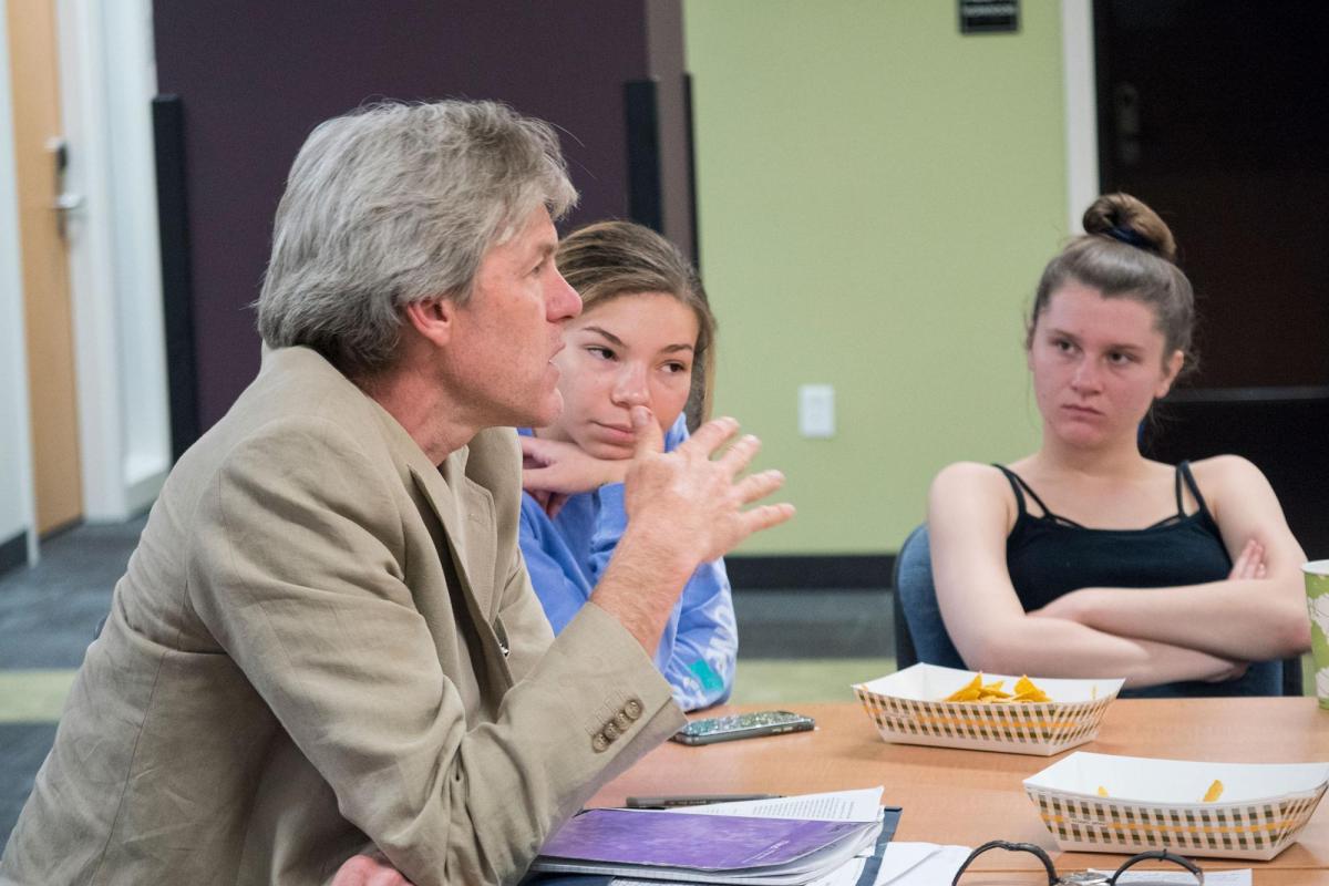 Professor talking to students