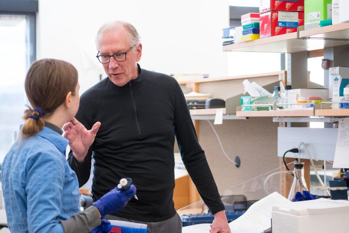 Professor and student in lab