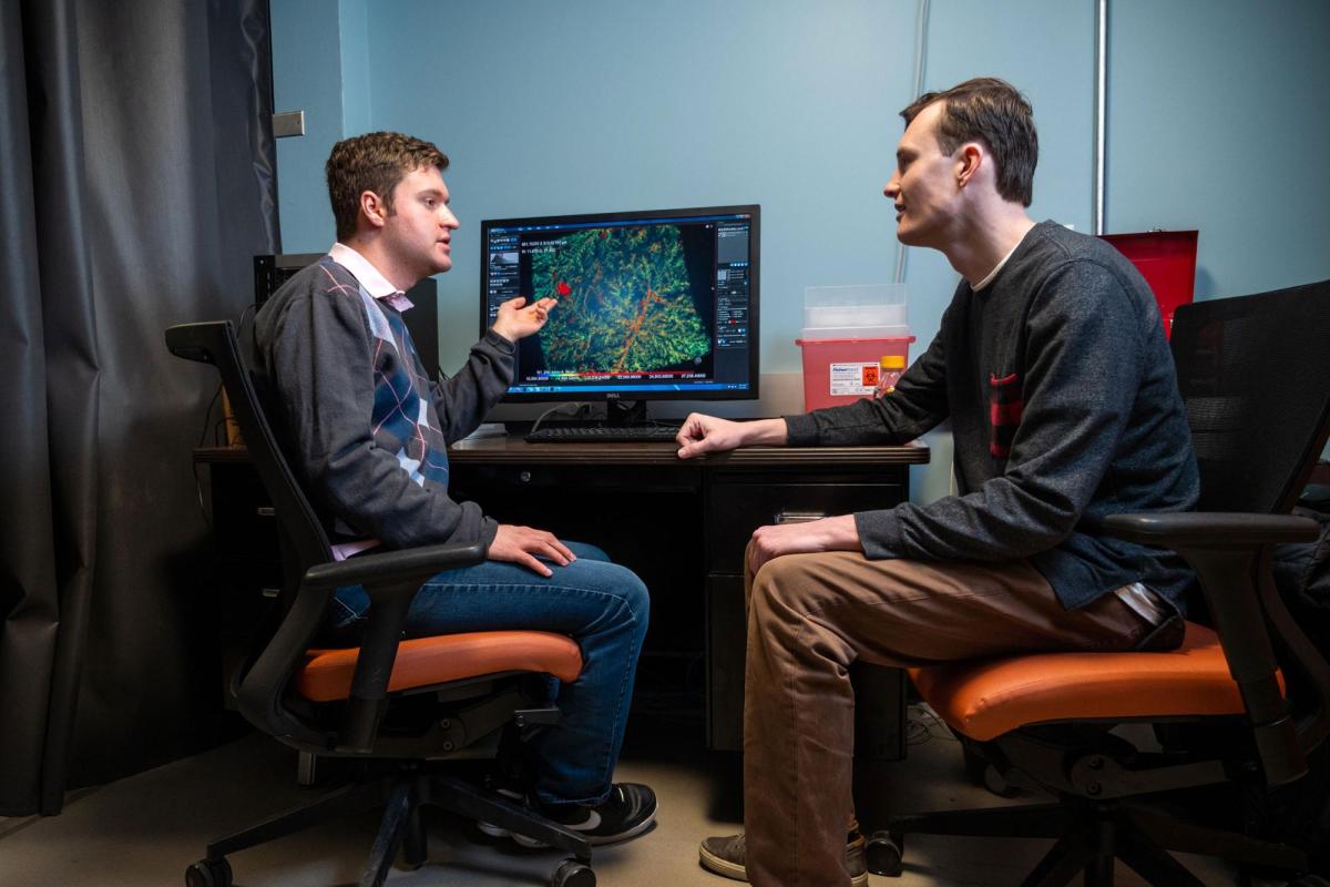 Researchers looking at monitor of Xradia