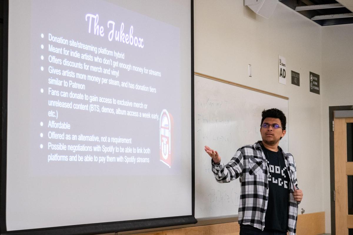 Student presenting in CMCI class