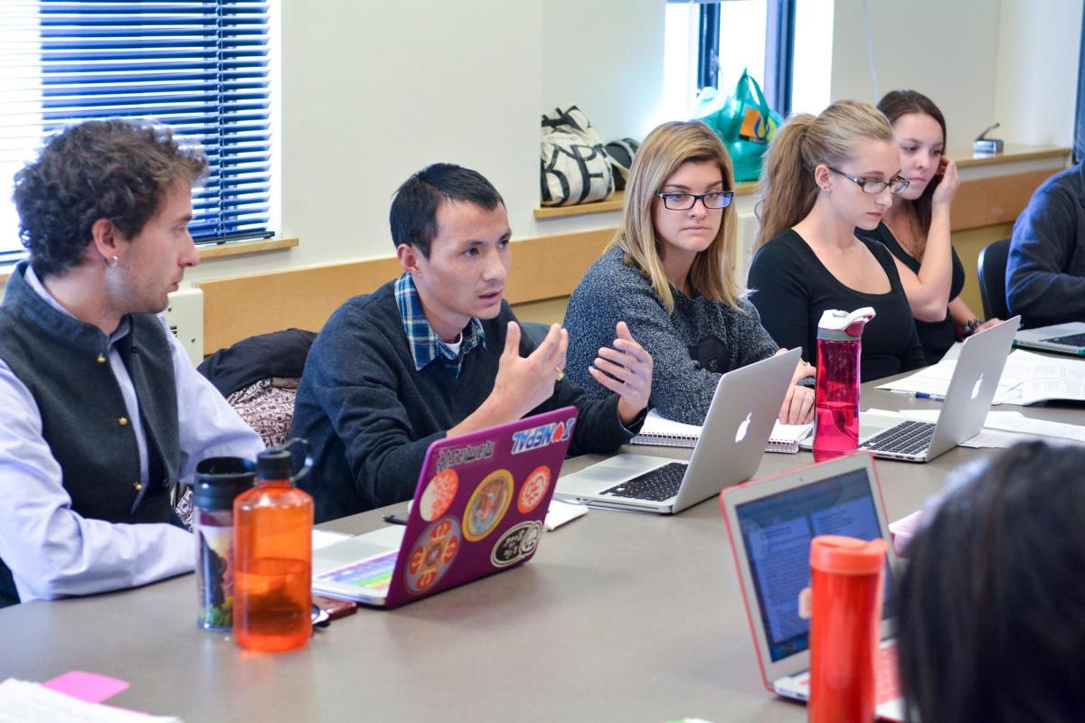 Students with laptops in Religious Studies class