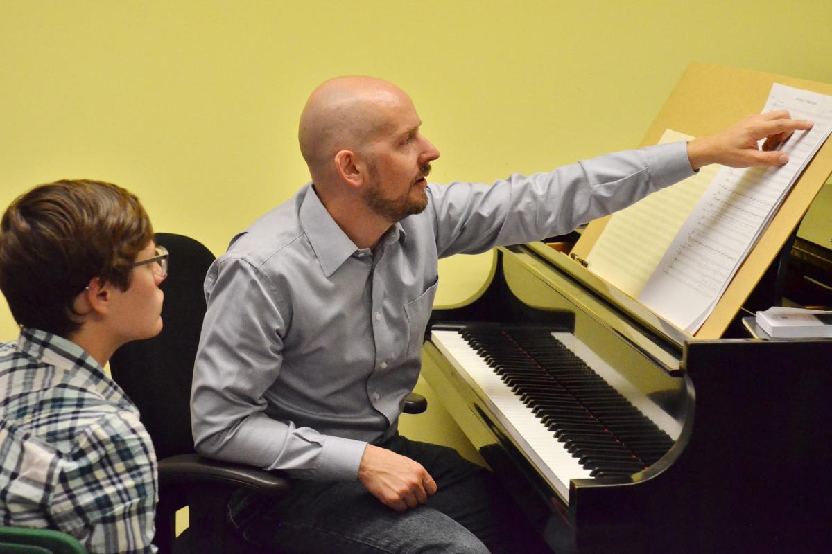 College of Music professor Daniel Kellogg works with a student in his office