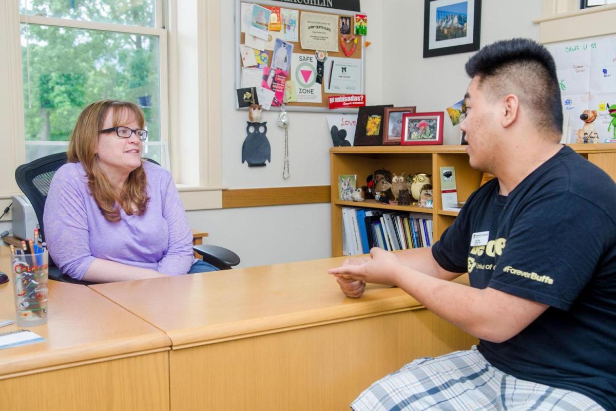 Advisor with student
