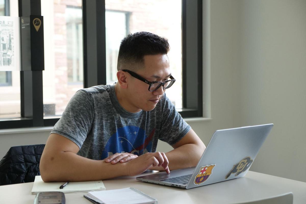Student looking at laptop