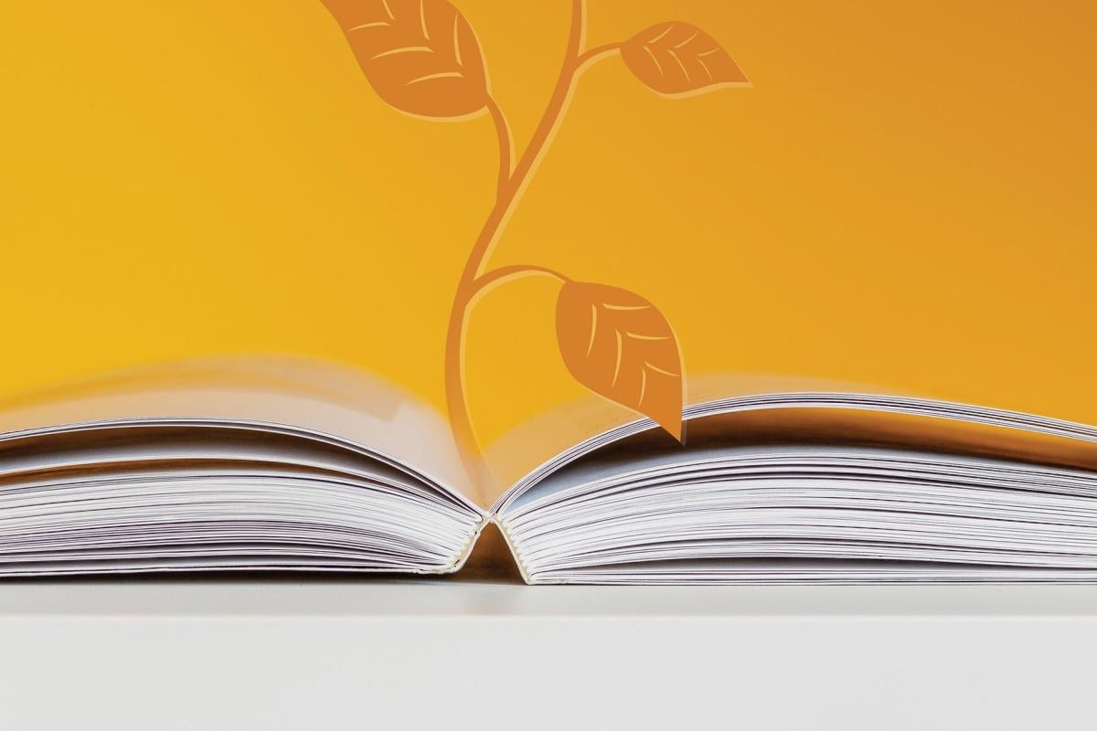 Open book and plant graphic
