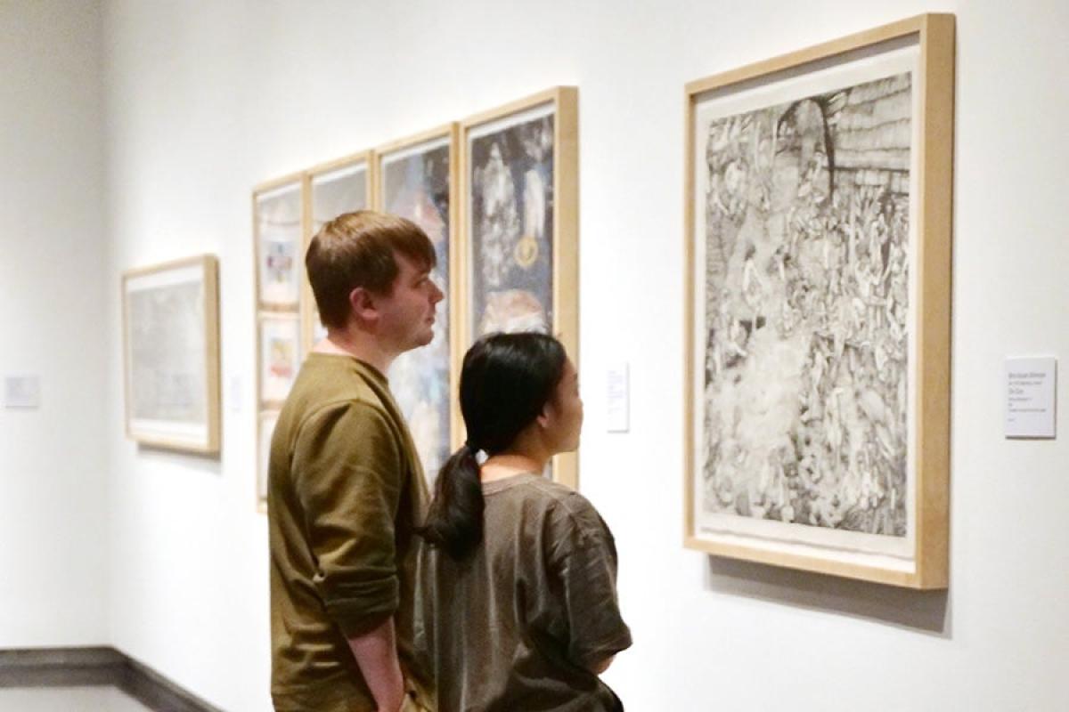 Museum patrons viewing artwork