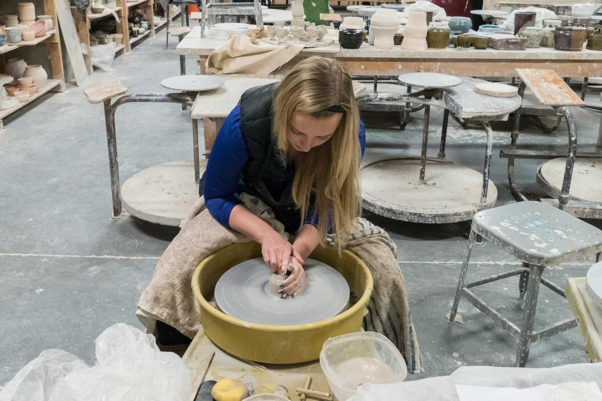 Student in wheel throwing class